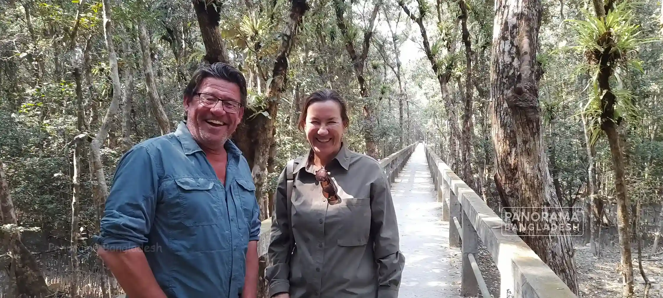 Travellers on a forest boardwalk in the Sundarbans mangrove forest, Bangladesh