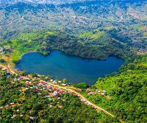 Aerial view of Boga Lake surrounded by lush green hills in Chittagong Hill Tracts.
