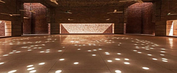 Prayer hall of the Baitur Rauf Mosque with geometric light patterns created by natural sunlight in Dhaka.